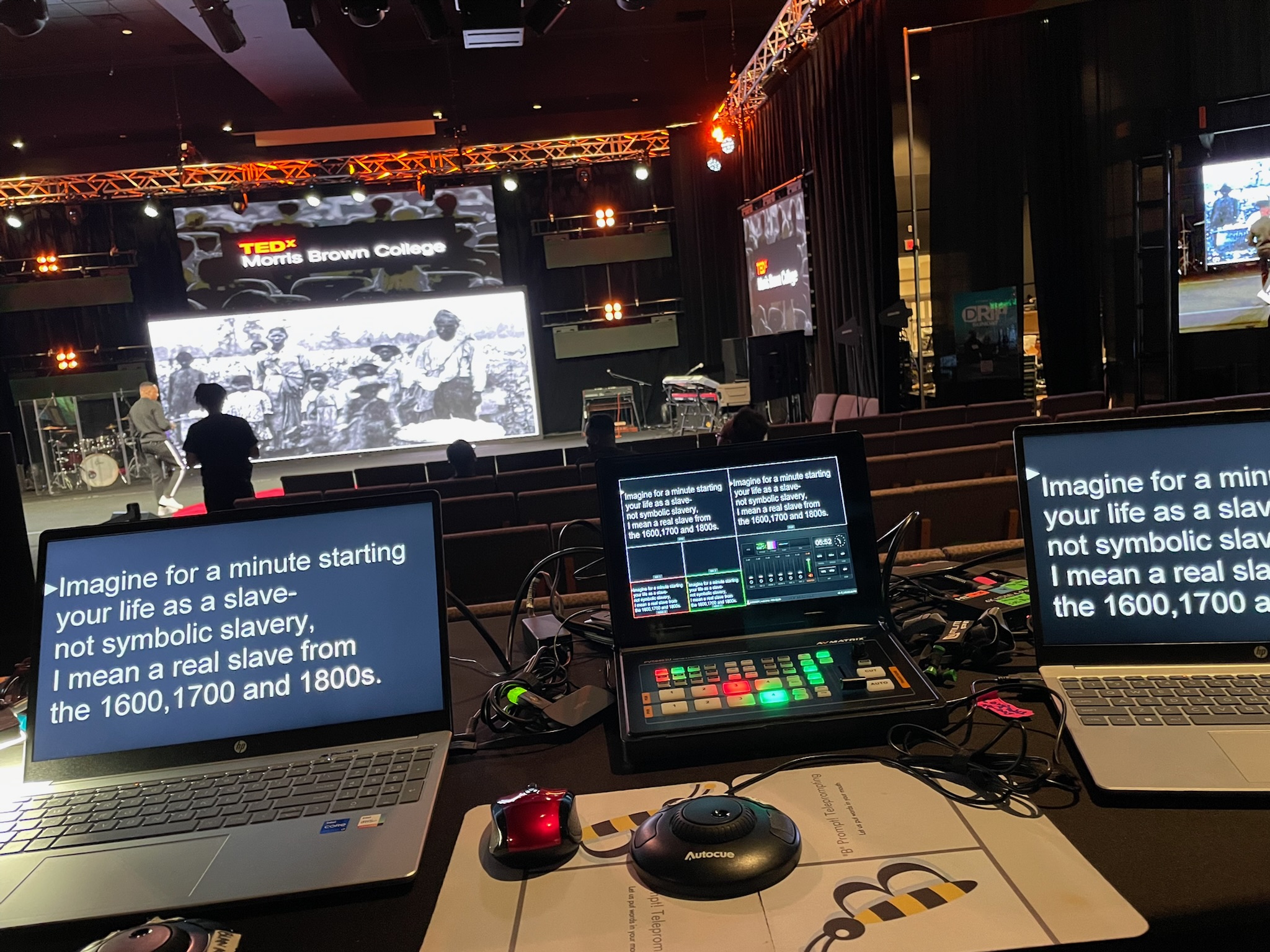 Multi-laptop teleprompter control station with an Autocue scroll puck at a TEDx event